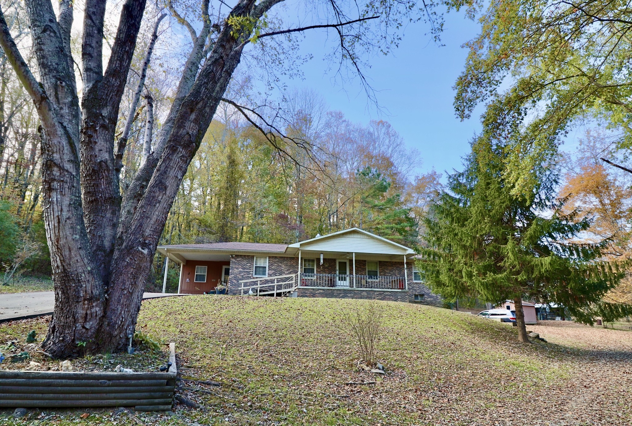 241 Mockerson Road Leoma, TN 38468 - Photo 6 of 43 a front view of a house with garden