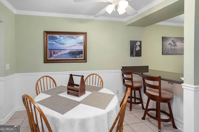 a view of a dining room and a livingroom with furniture