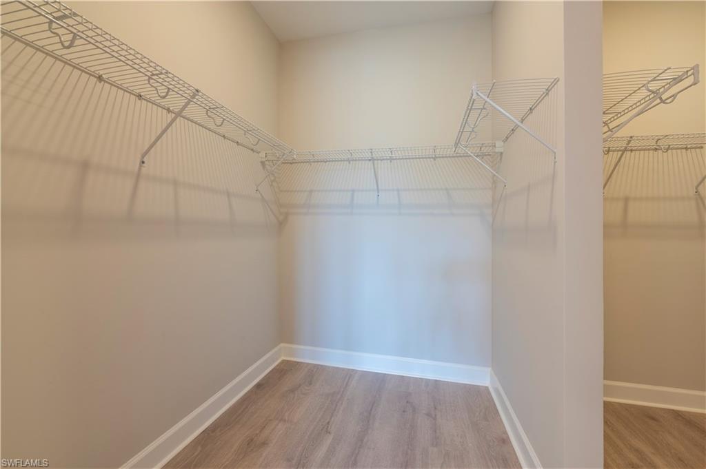 15633 Gavello Street Naples, FL 34114 - Photo 13 of 37 a view of a room with racks on the wall