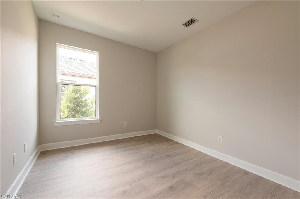 15633 Gavello Street Naples, FL 34114 - Photo 19 of 37 an empty room with a window