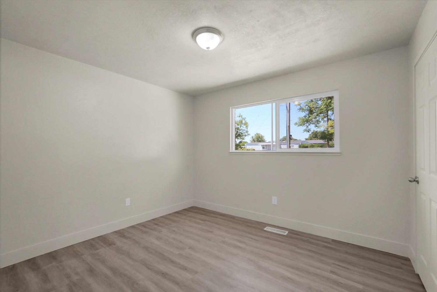 2832 Fowler Road Ceres, CA 95307 - Photo 15 of 28 an empty room with a window