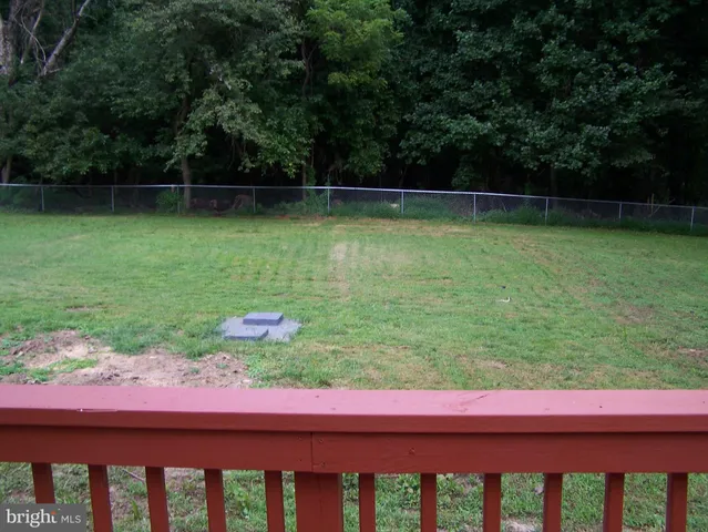 a view of a two chairs in the yard
