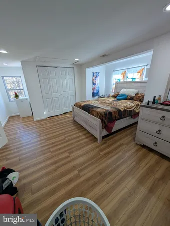 a spacious bedroom with a bed and window