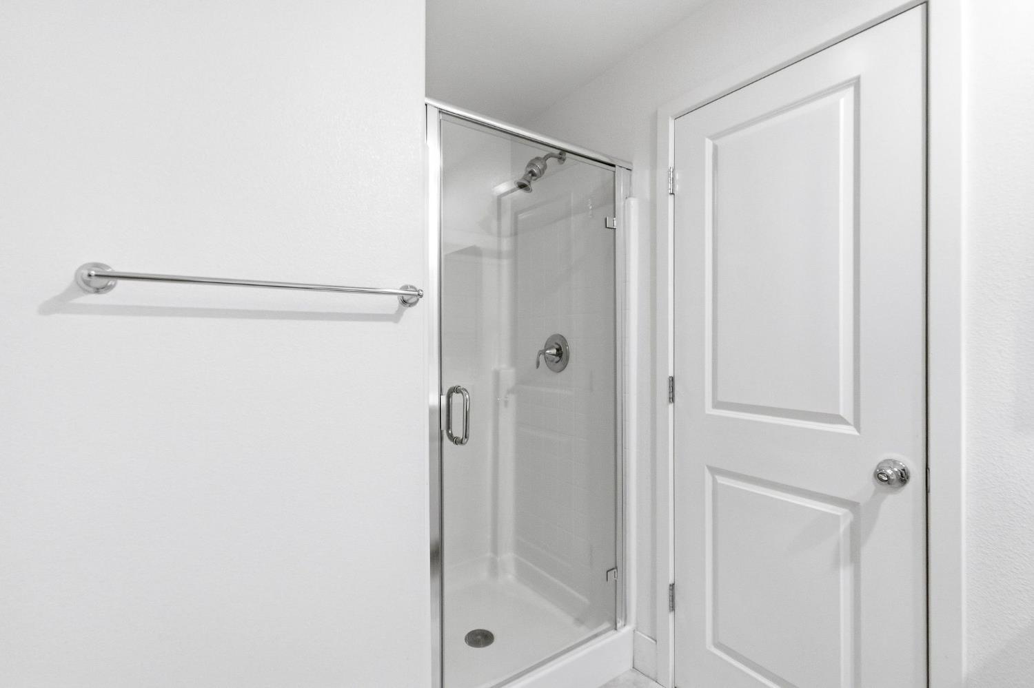 2564 Prosper Road Sacramento, CA 95834 - Photo 24 of 46 a bathroom with a glass shower door