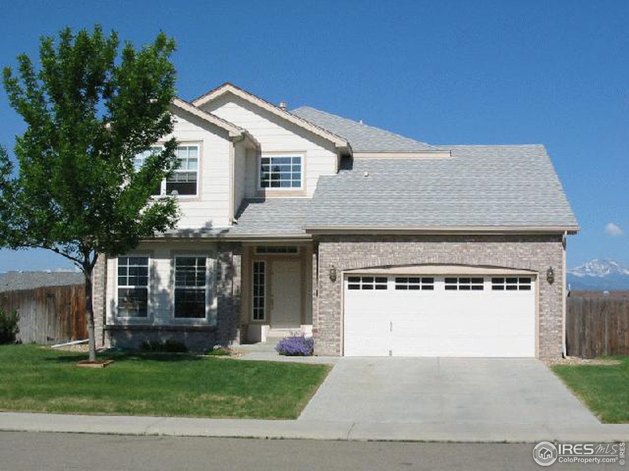 628 Rider Ridge Drive Longmont, CO 80504 - Photo 1 of 9 a front view of a house with a yard and garage