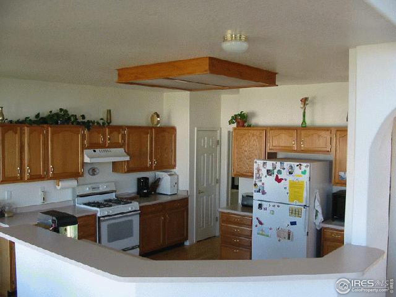 628 Rider Ridge Drive Longmont, CO 80504 - Photo 5 of 9 a kitchen with stainless steel appliances granite countertop a refrigerator and stove