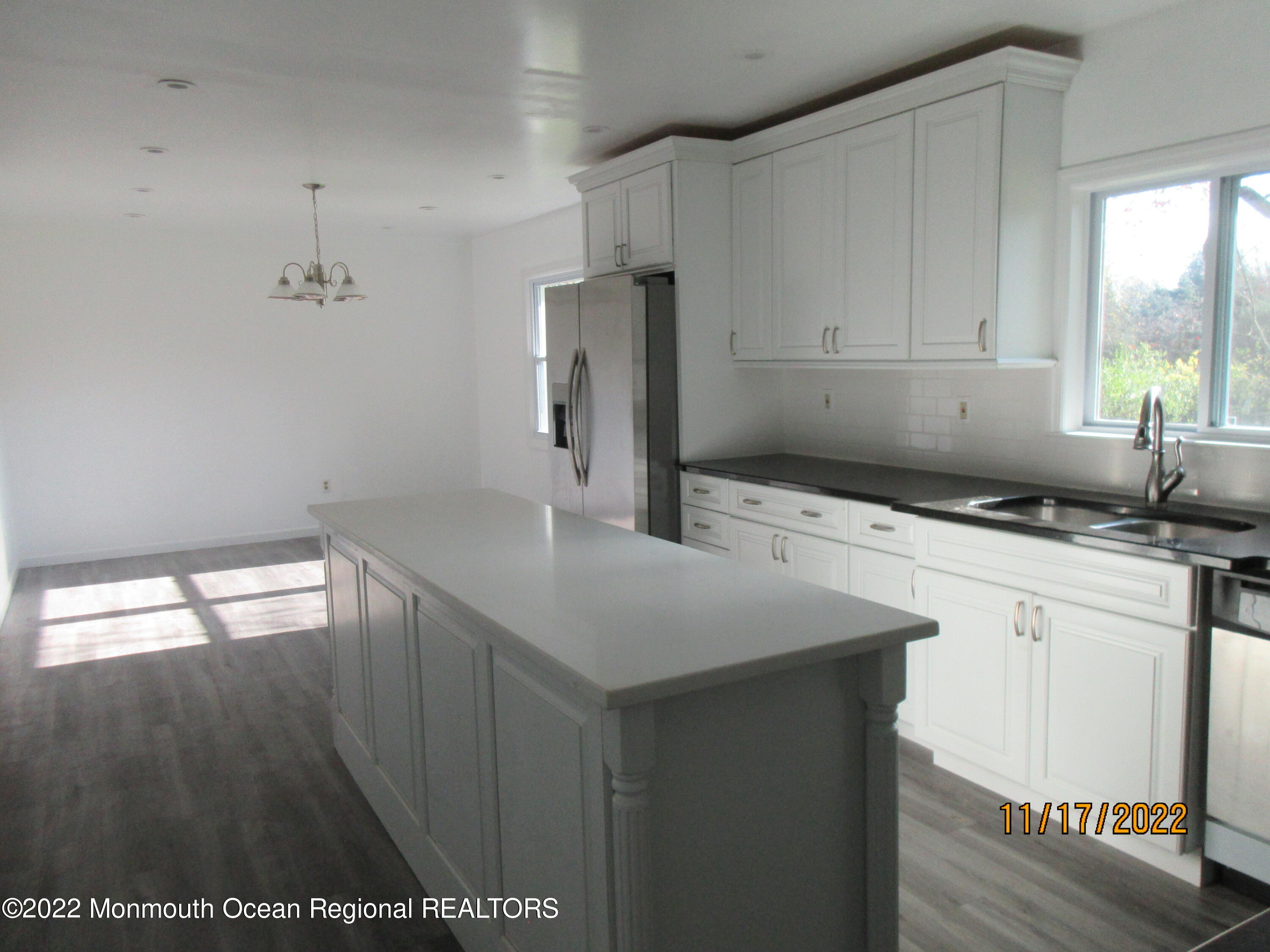 28 New Friendship Road Howell, NJ 07731 - Photo 5 of 29 a kitchen that has a sink a window and stainless steel appliances