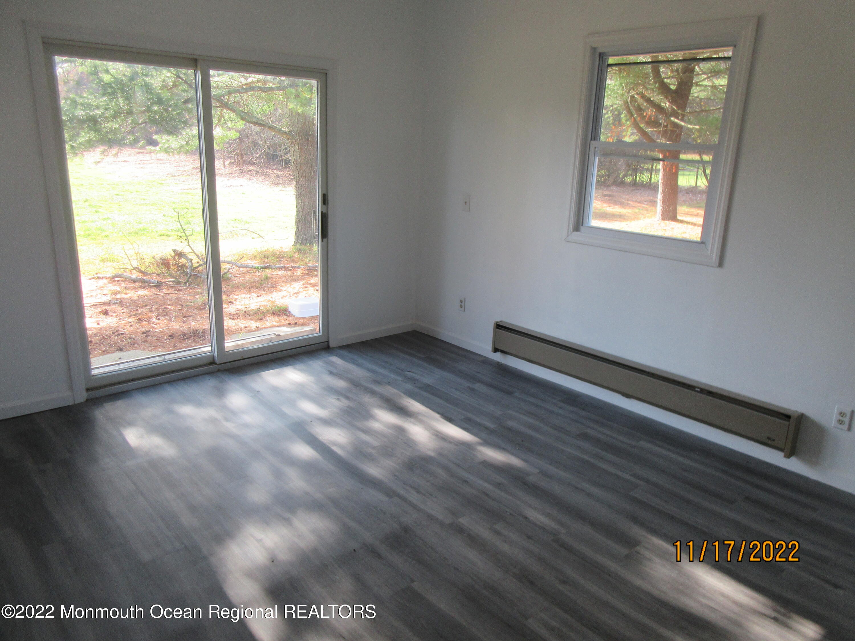 28 New Friendship Road Howell, NJ 07731 - Photo 9 of 29 a view of an empty room with wooden floor and a window