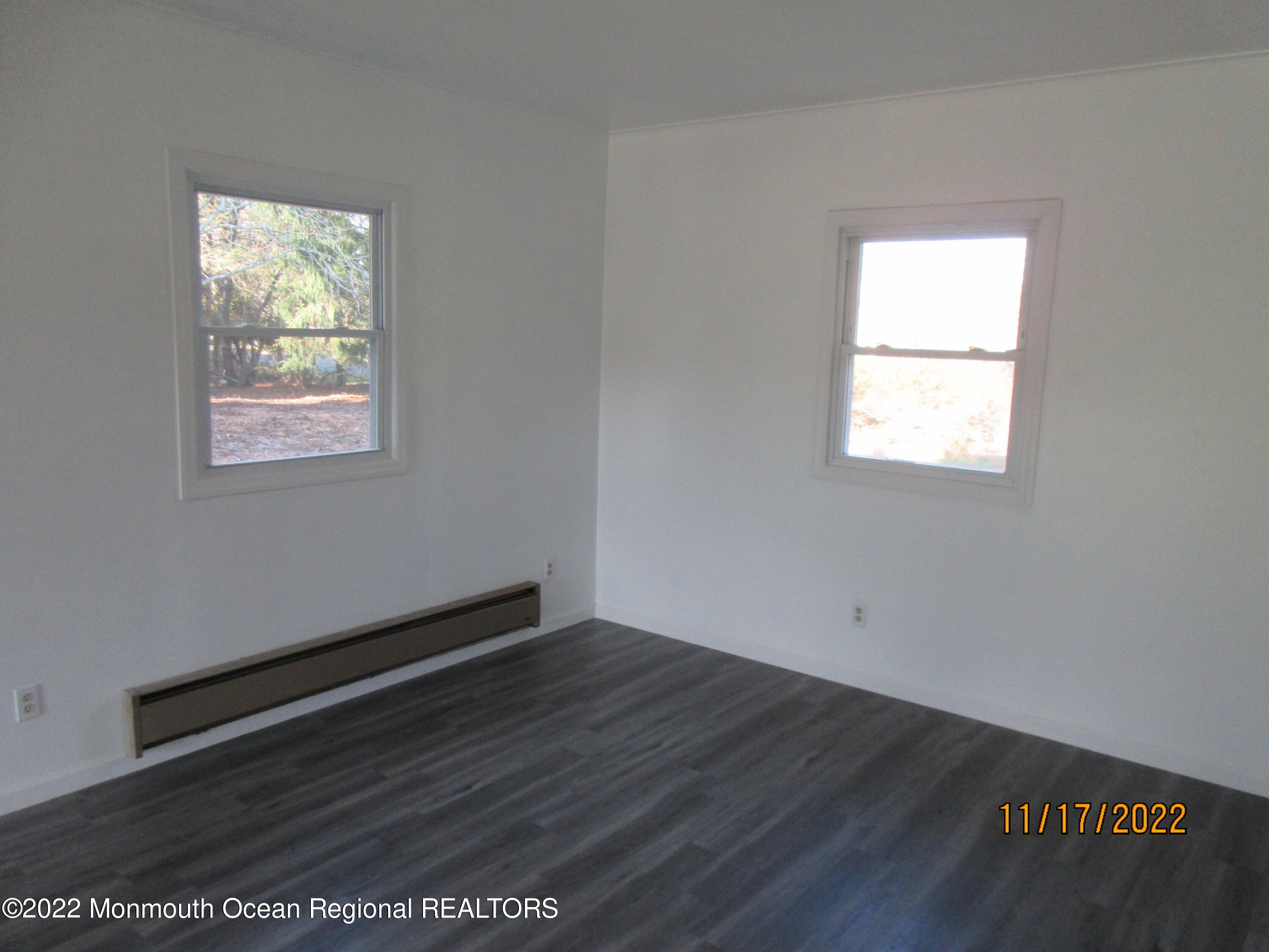 28 New Friendship Road Howell, NJ 07731 - Photo 10 of 29 an empty room with wooden floor and windows