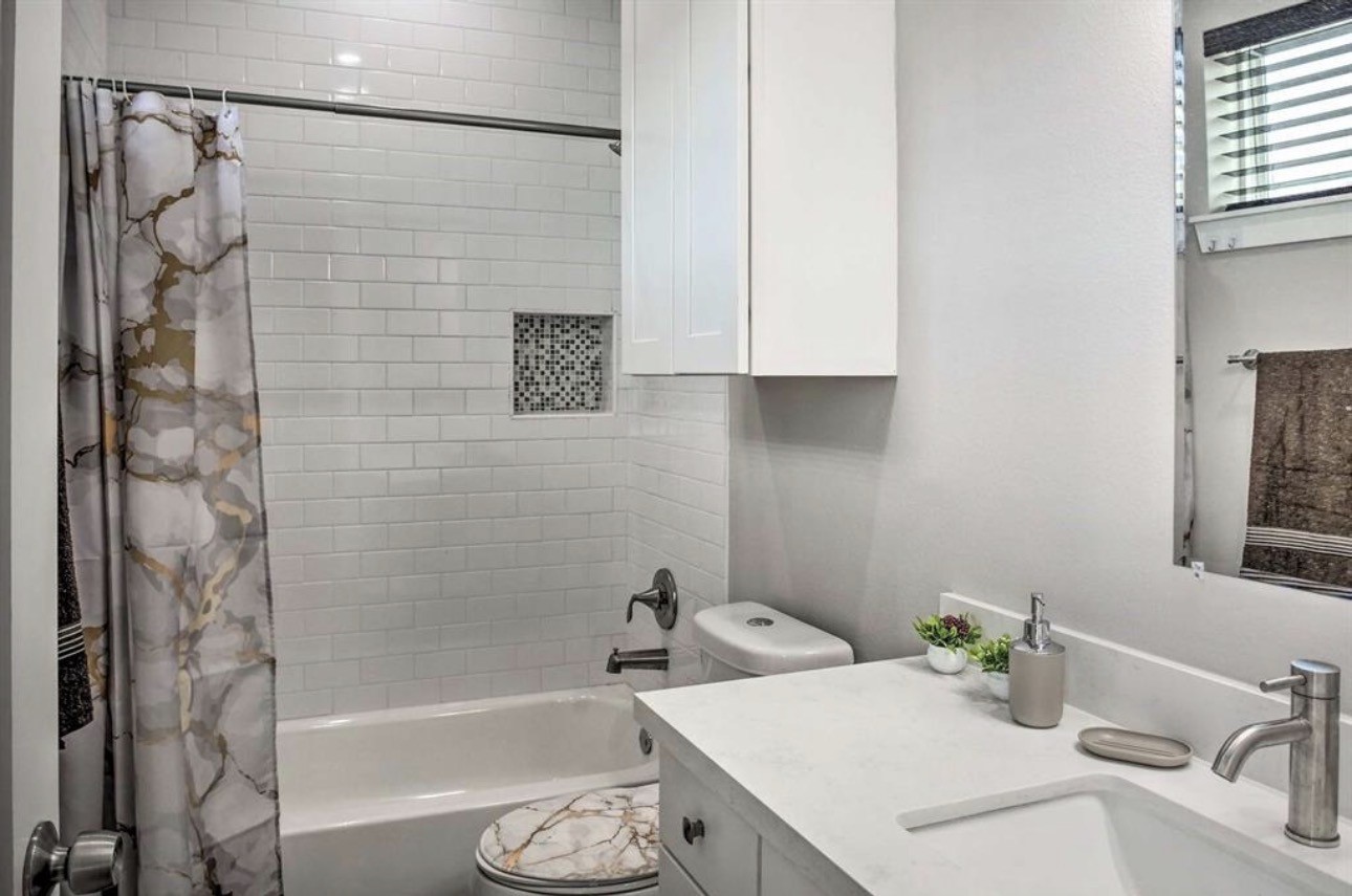 6403 Bowling Green Street Houston, TX 77021 - Photo 26 of 31 a bathroom with a sink a toilet and shower