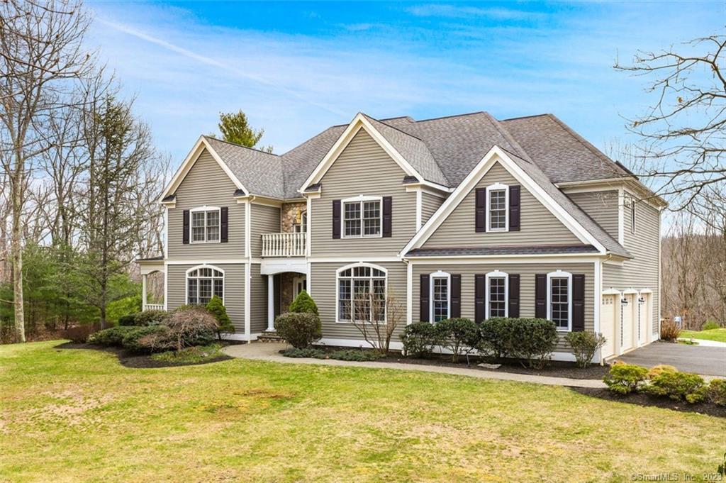 18 Clapboard Ridge Newtown, CT 06482 - Photo 1 of 1 a front view of a house with a yard