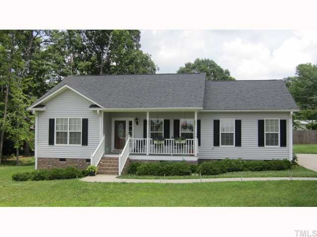 145 Sam Brummitt Road Henderson, NC 27537 - Photo 1 of 11 a house view with a garden space