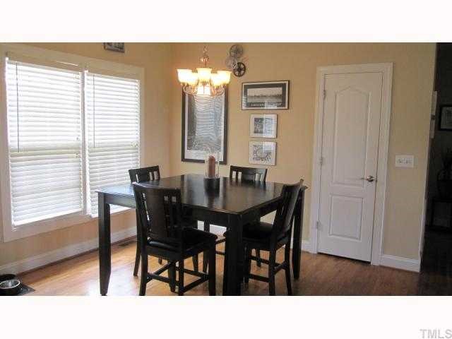 145 Sam Brummitt Road Henderson, NC 27537 - Photo 5 of 11 a kitchen with a table and chairs in it