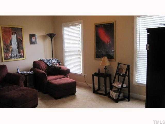 145 Sam Brummitt Road Henderson, NC 27537 - Photo 8 of 11 a living room with furniture and a window