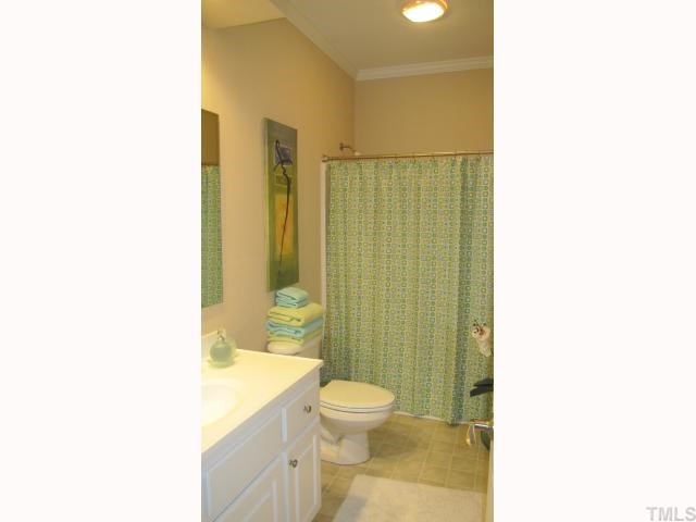 145 Sam Brummitt Road Henderson, NC 27537 - Photo 9 of 11 a bathroom with a sink a toilet and shower