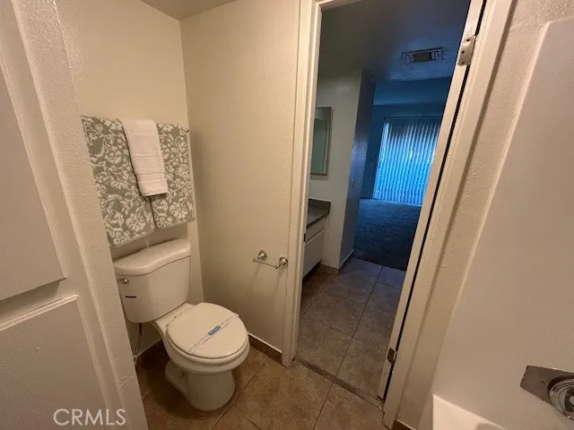a view of a patio with table and chairs