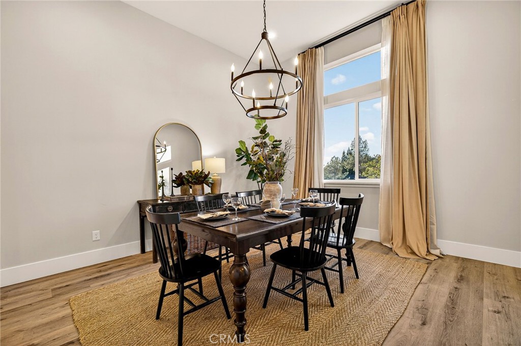 5772 Acorn Ridge Drive Paradise, CA 95969 - Photo 23 of 59 a view of a dining room with furniture window and wooden floor