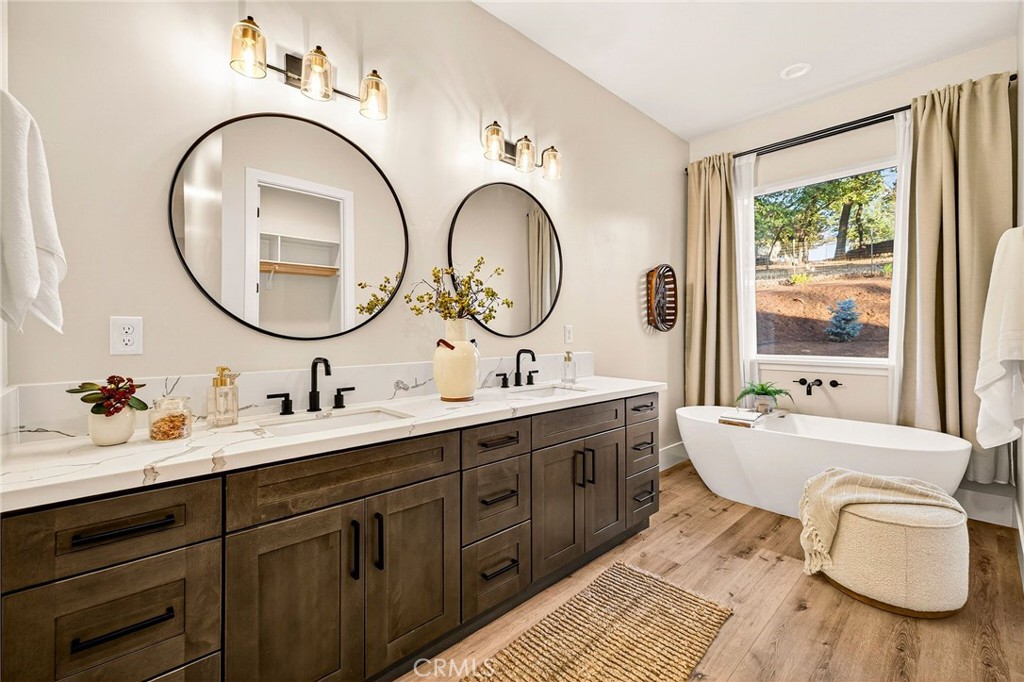 5772 Acorn Ridge Drive Paradise, CA 95969 - Photo 27 of 59 a bathroom with a double vanity sink and a mirror