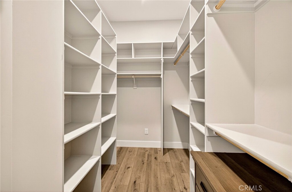 5772 Acorn Ridge Drive Paradise, CA 95969 - Photo 31 of 59 a view of walk in closet with wooden floor and entryway