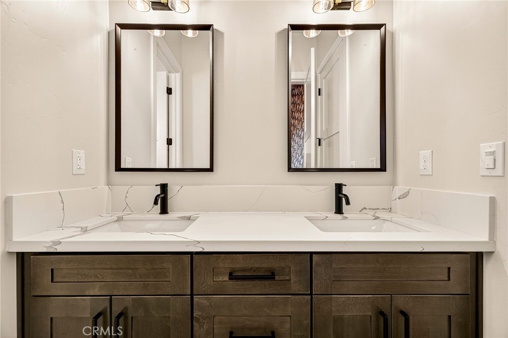 5772 Acorn Ridge Drive Paradise, CA 95969 - Photo 34 of 59 a bathroom with double sink and two mirror