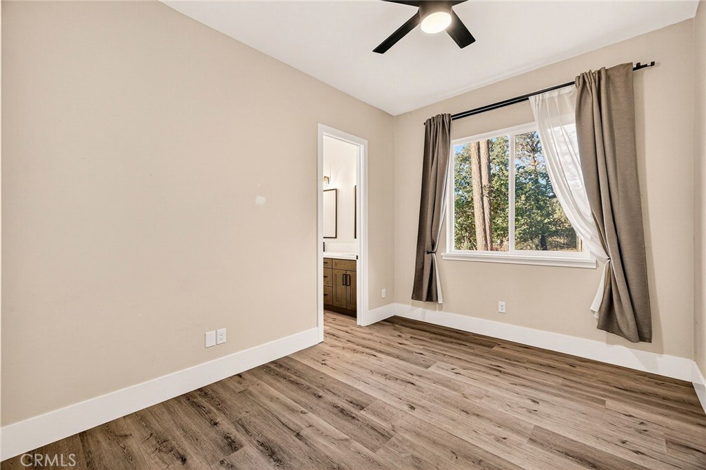 5772 Acorn Ridge Drive Paradise, CA 95969 - Photo 37 of 59 a view of an empty room with wooden floor and a window
