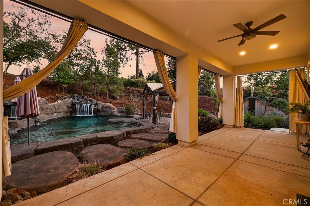 5772 Acorn Ridge Drive Paradise, CA 95969 - Photo 40 of 59 a view of a porch with a floor to ceiling window and a yard