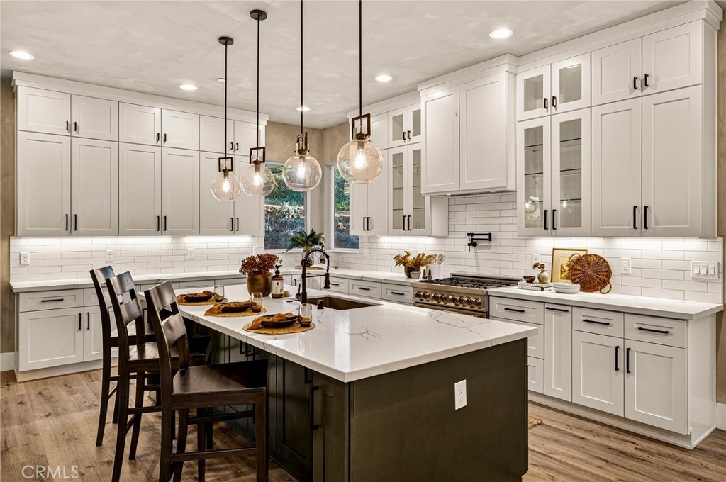 5772 Acorn Ridge Drive Paradise, CA 95969 - Photo 4 of 59 a kitchen with a sink a stove a dining table and chairs