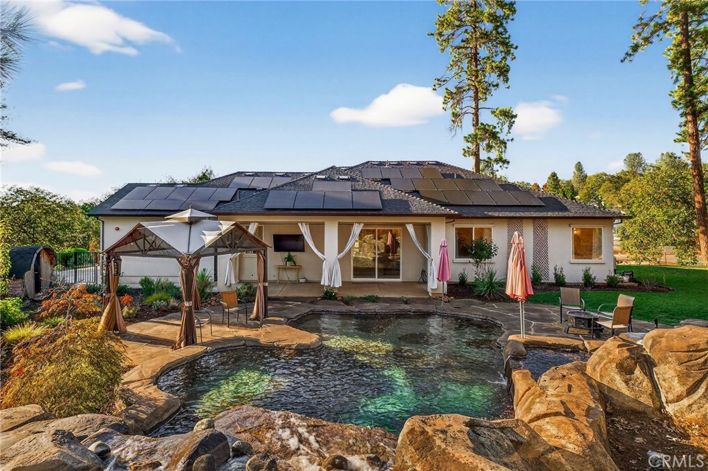 5772 Acorn Ridge Drive Paradise, CA 95969 - Photo 43 of 59 a view of a house with backyard water fountain and sitting area