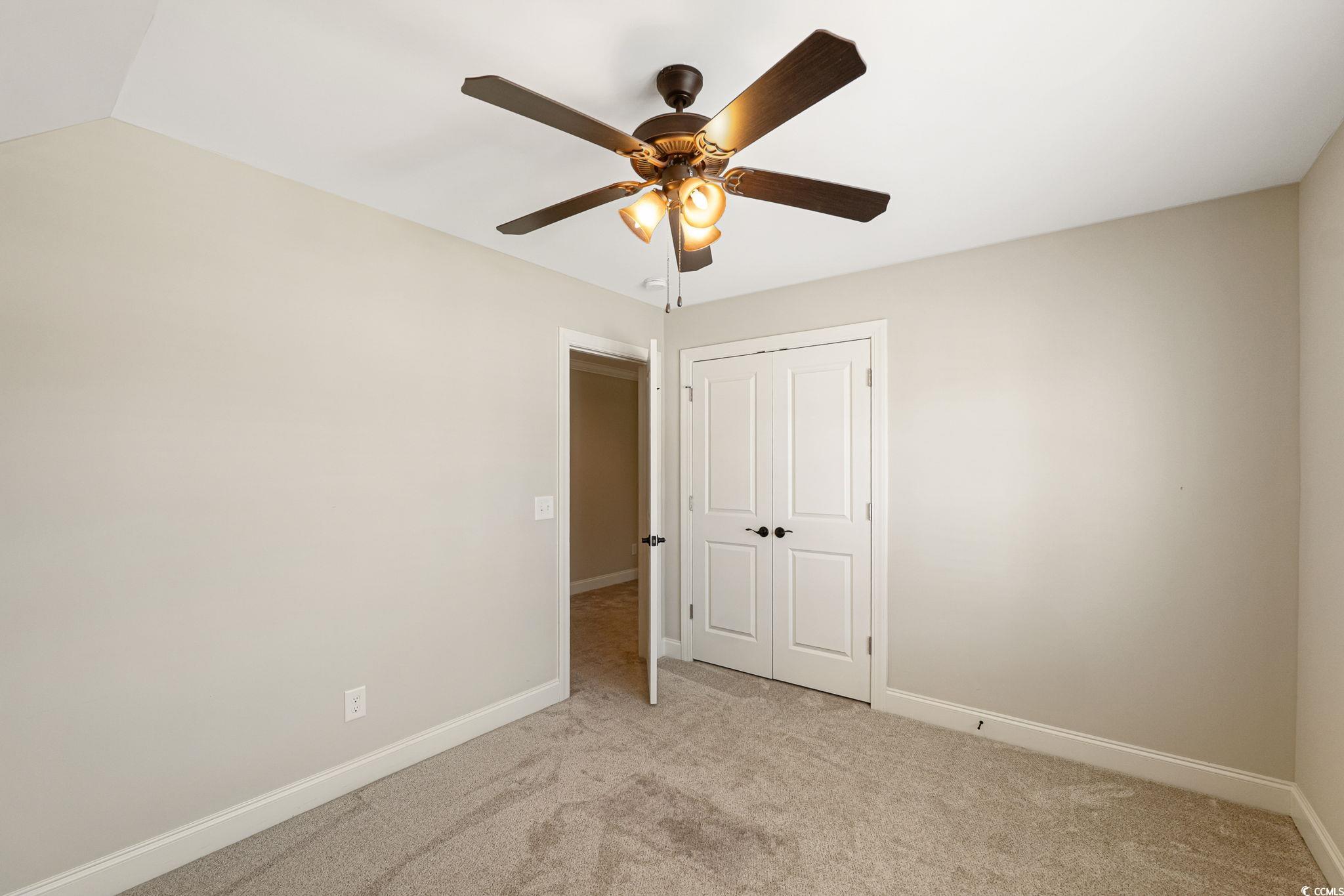 3200 West Strada Santa Florence, SC 29501 - Photo 15 of 40 Unfurnished bedroom featuring light carpet, basebo