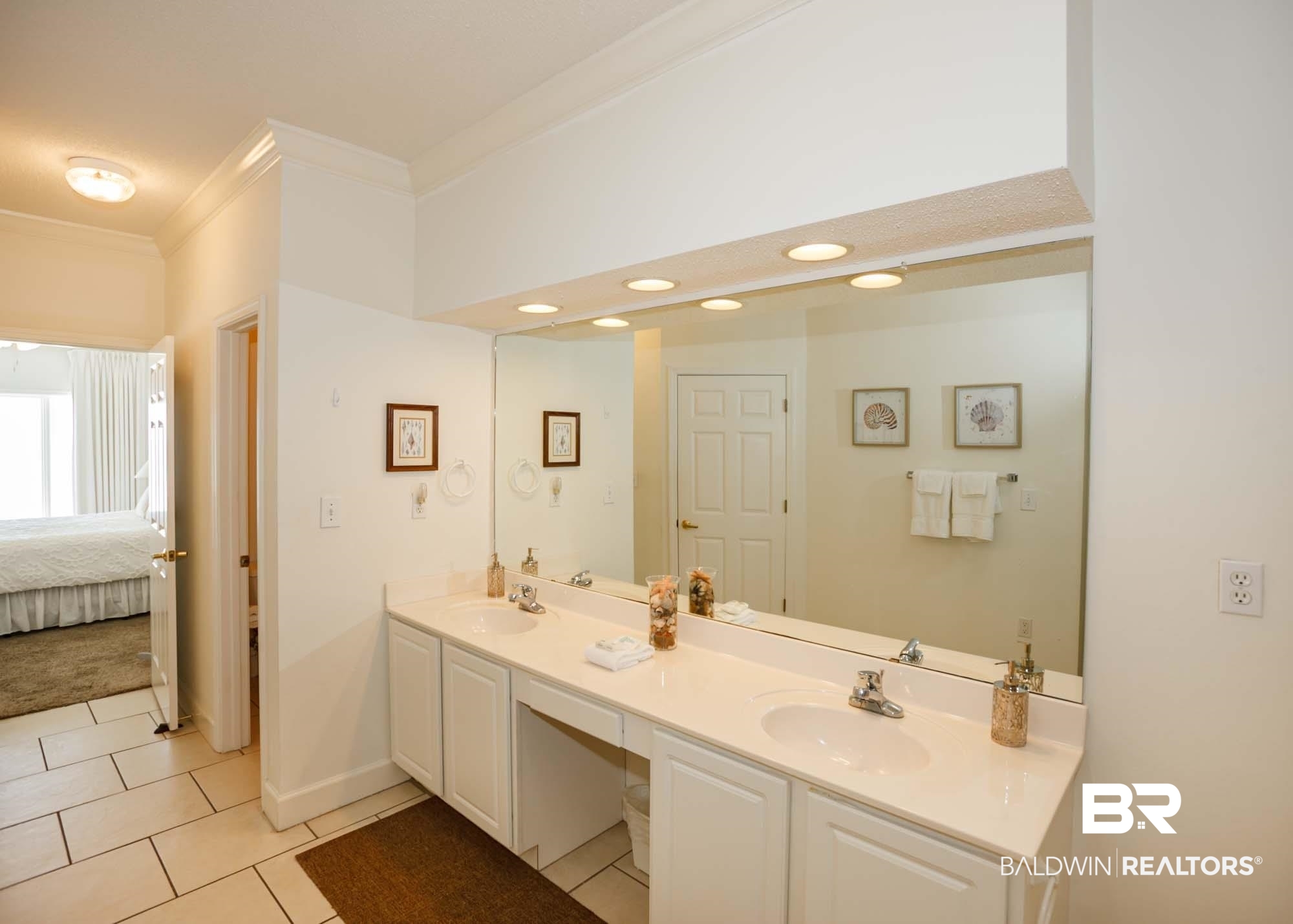 28910 Perdido Beach Boulevard, Unit 4B Orange Beach, AL 36561 - Photo 25 of 48 Bathroom with tile patterned flooring, a sink, ornamental molding, and double vanity