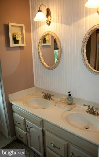 3005 Jackson Ridge Court Phoenix, MD 21131 - Photo 8 of 22 a bathroom with a sink and a mirror