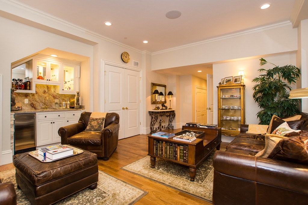 1 Winter Place, Unit 2 Boston, MA 02108 - Photo 11 of 17 a living room with furniture and a large window
