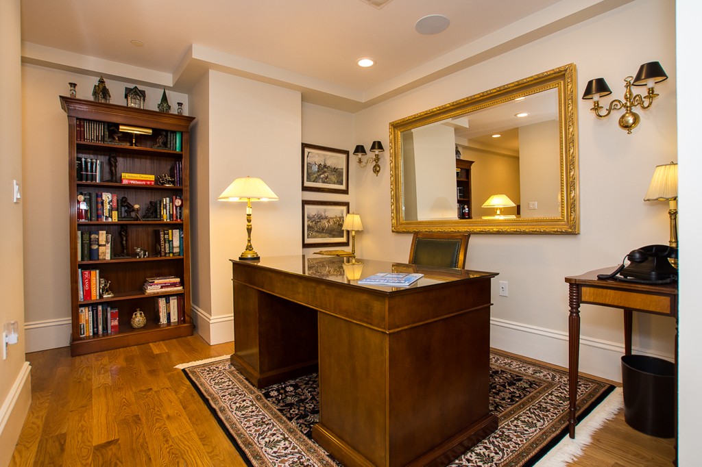 1 Winter Place, Unit 2 Boston, MA 02108 - Photo 16 of 17 a living room with furniture and a book shelf