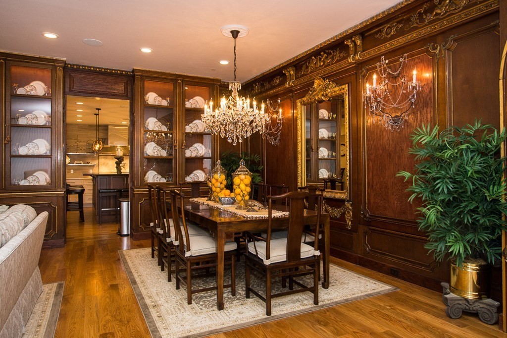 1 Winter Place, Unit 2 Boston, MA 02108 - Photo 7 of 17 a view of a dining room with furniture and chandelier