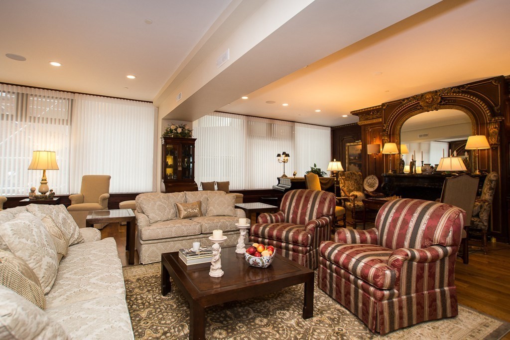 1 Winter Place, Unit 2 Boston, MA 02108 - Photo 8 of 17 a living room with furniture kitchen view and a large window