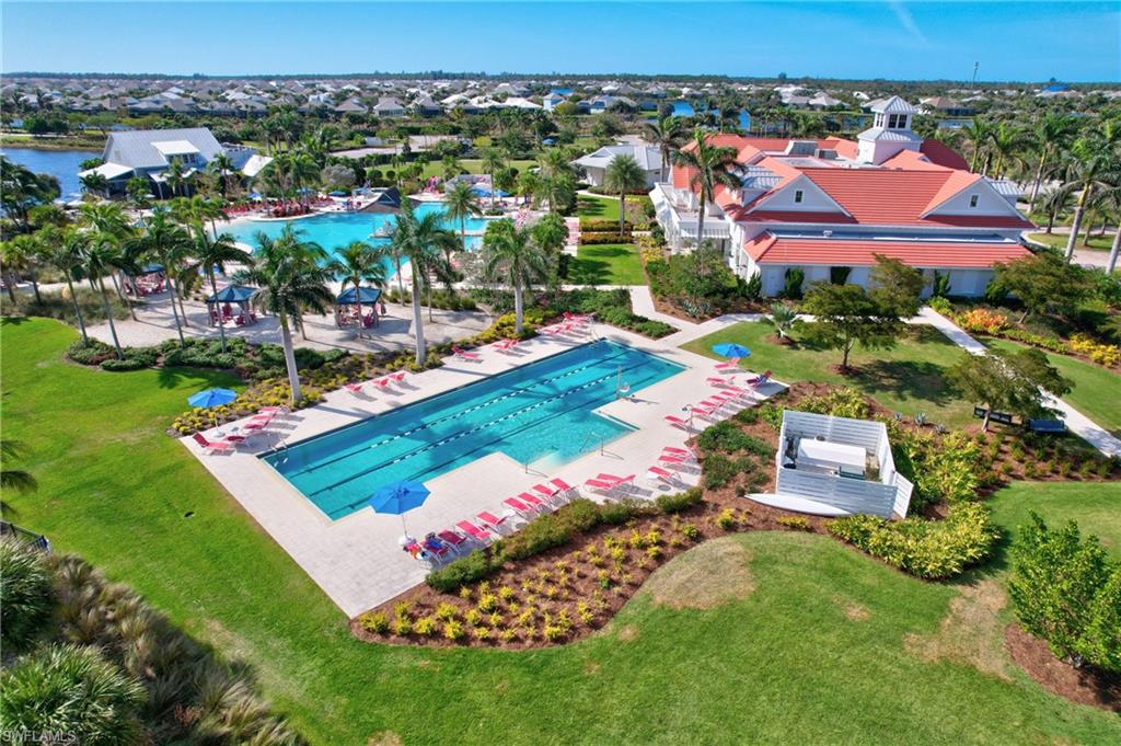 6553 Dominica Drive, Unit 101 Naples, FL 34113 - Photo 22 of 27 an aerial view of residential houses with outdoor space and trees