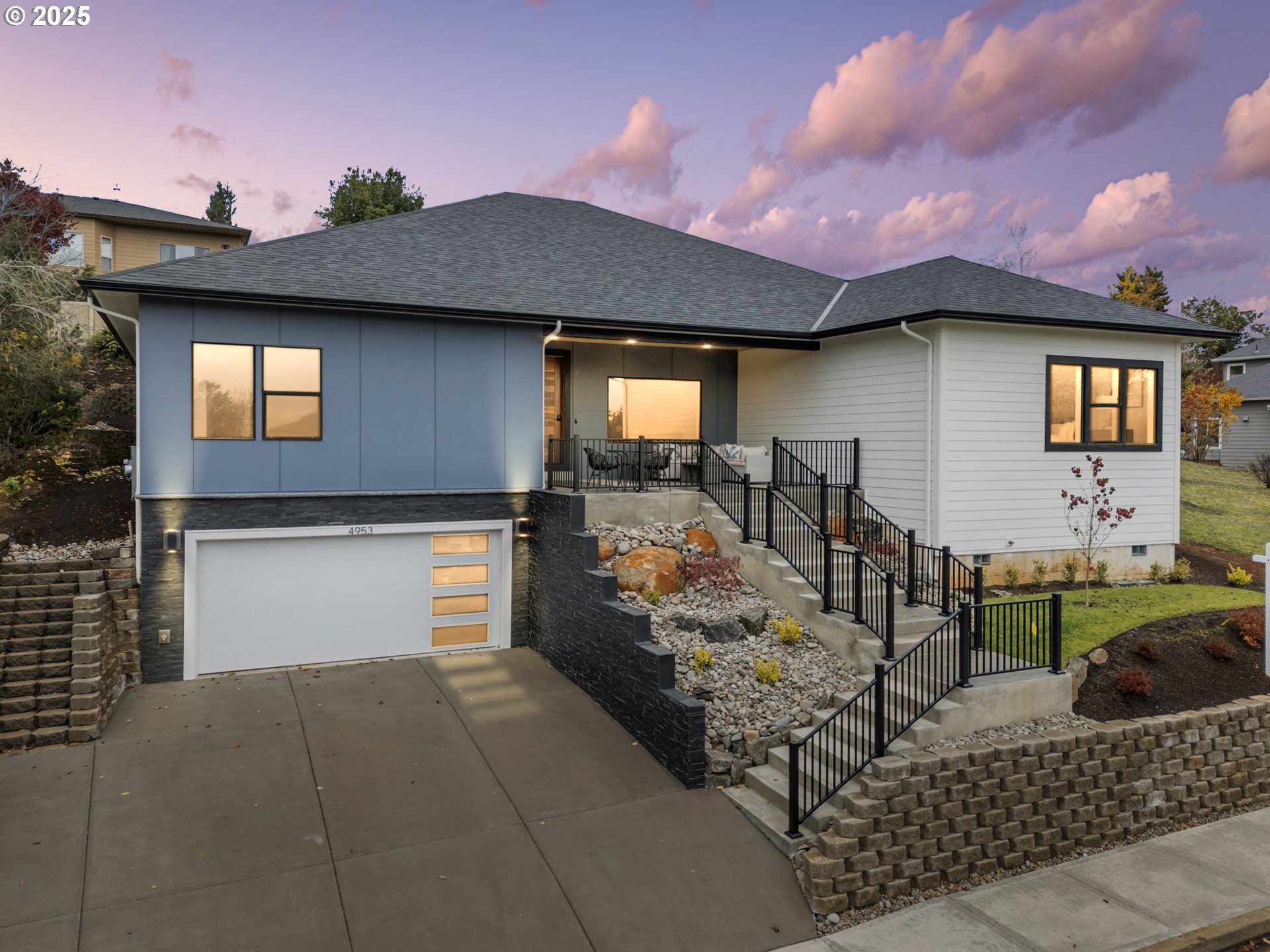 a front view of a house with garden