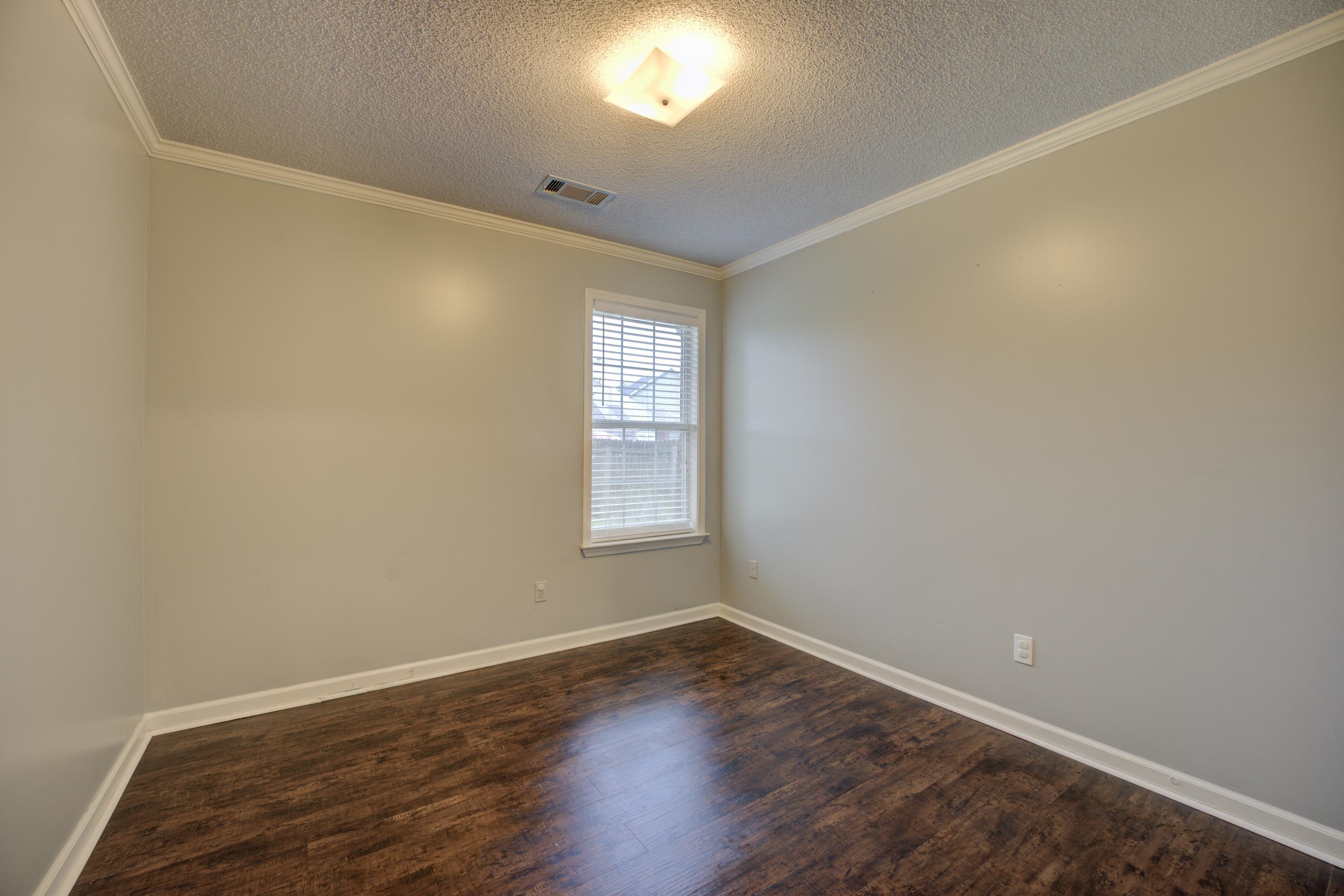 459 North Ericson Road Memphis, TN 38018 - Photo 16 of 27 Sleep tight in the second bedroom with a closet, cooling ceiling fan and luxury vinyl plank floors.