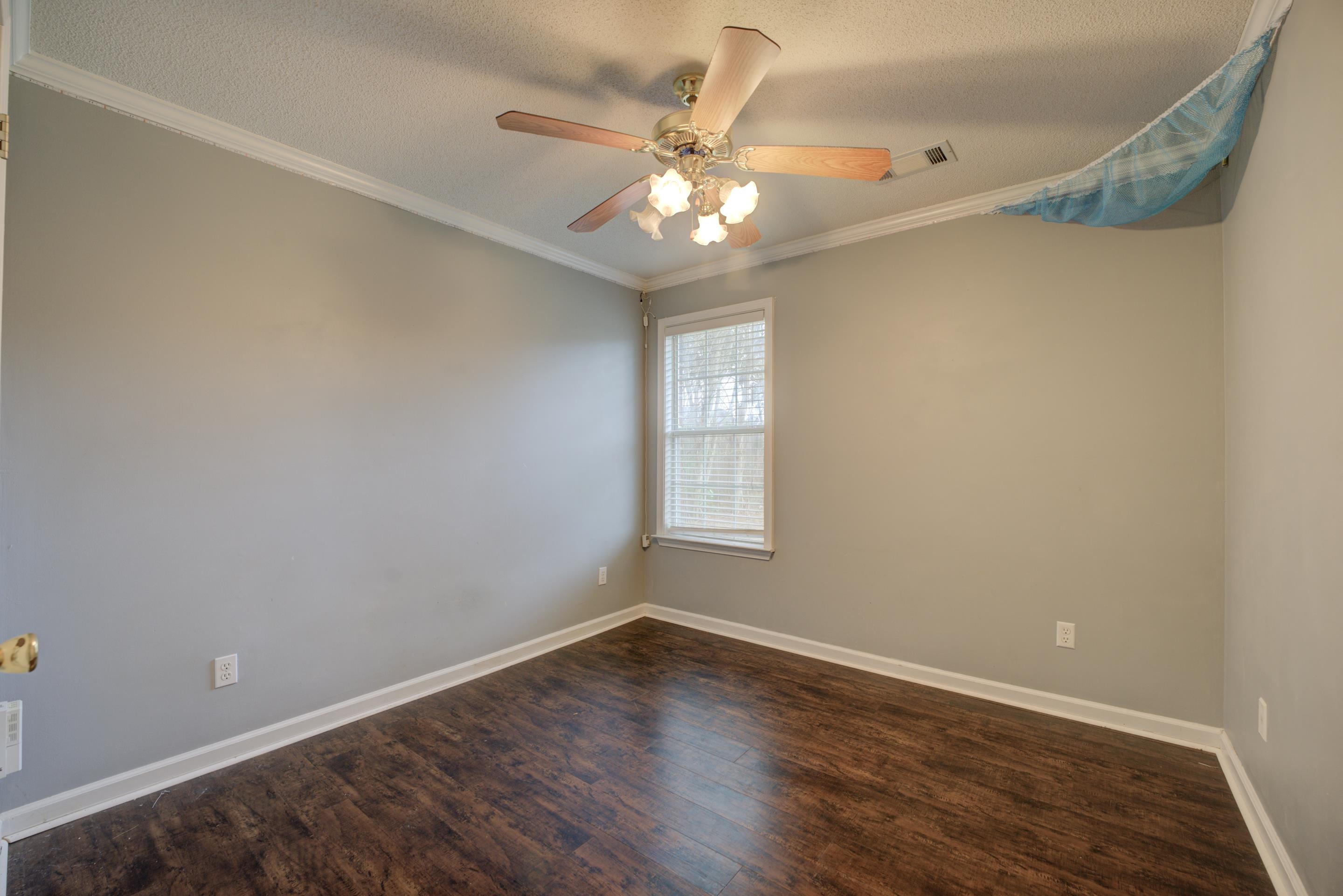459 North Ericson Road Memphis, TN 38018 - Photo 19 of 27 Unwind in the third bedroom with a closet, cooling ceiling fan and luxury vinyl plank floors.