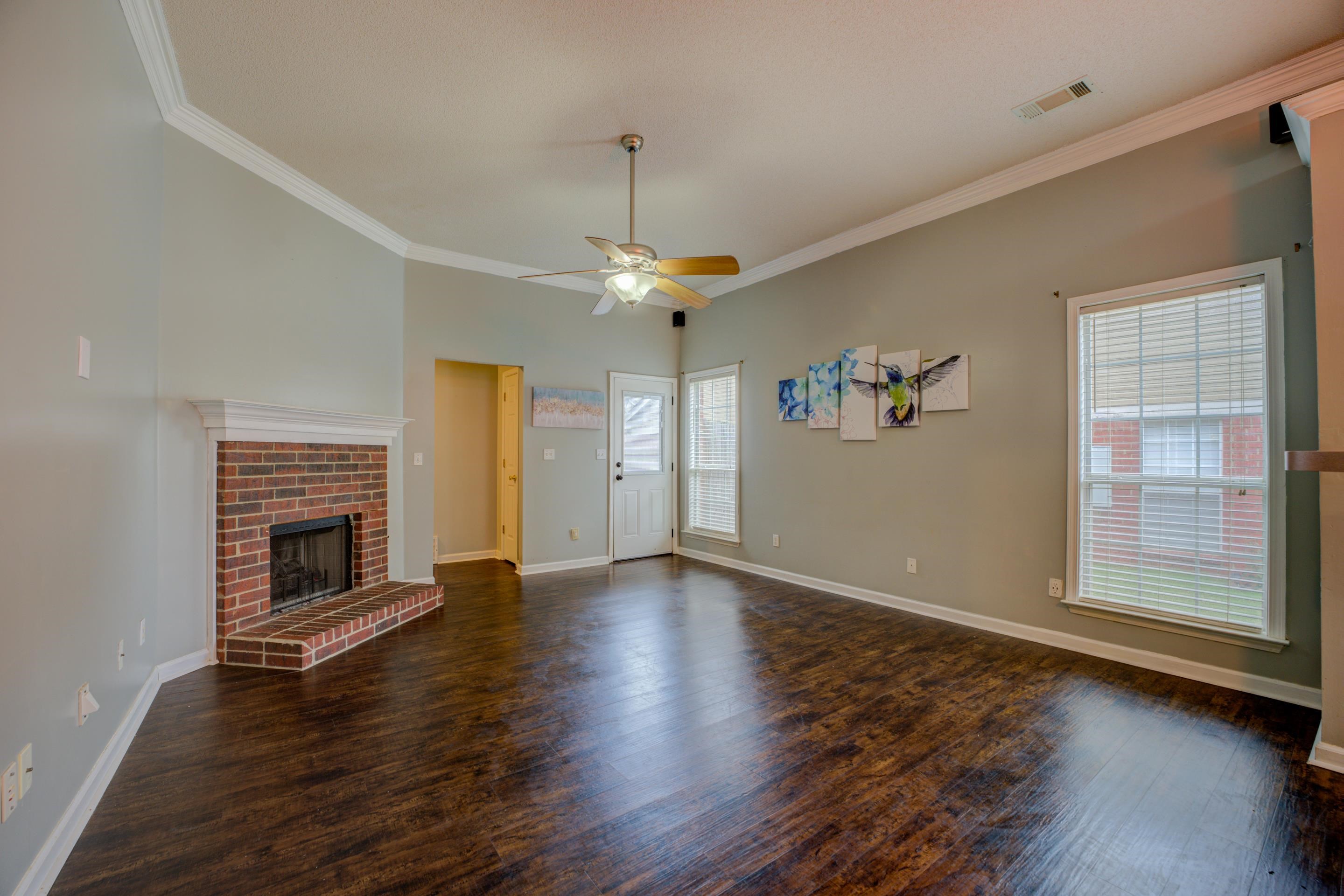 459 North Ericson Road Memphis, TN 38018 - Photo 4 of 27 The great room is anchored by a cozy fireplace, making it the perfect spot to gather with friends or enjoy a quiet night in.