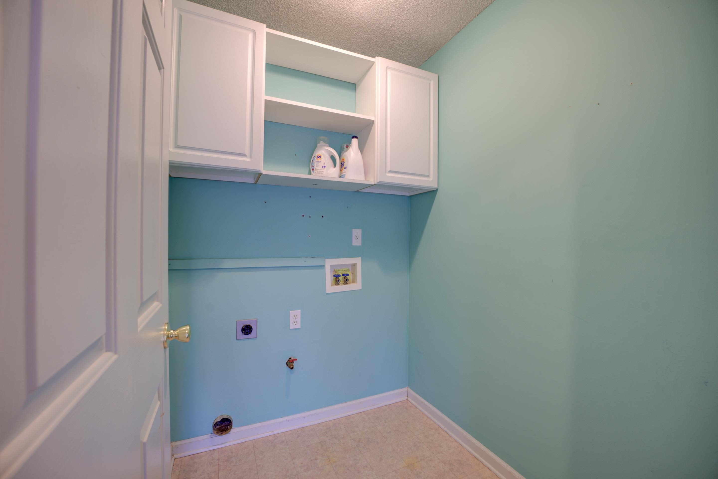 459 North Ericson Road Memphis, TN 38018 - Photo 10 of 27 Doing laundry will be a breeze in this laundry room with cabinets.