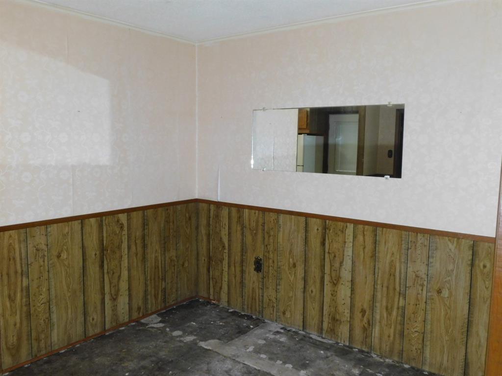 214 Springhill Airport Road Springhill, LA 71075 - Photo 13 of 32 a view of a wooden door