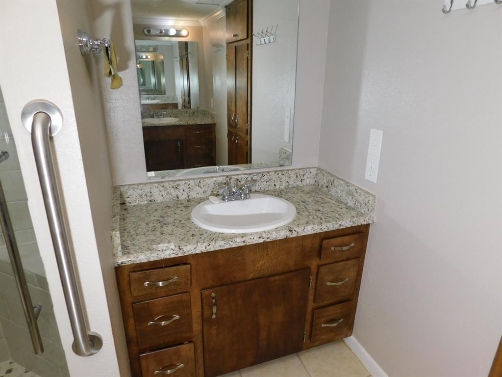 214 Springhill Airport Road Springhill, LA 71075 - Photo 18 of 32 a bathroom with a granite countertop sink and a mirror