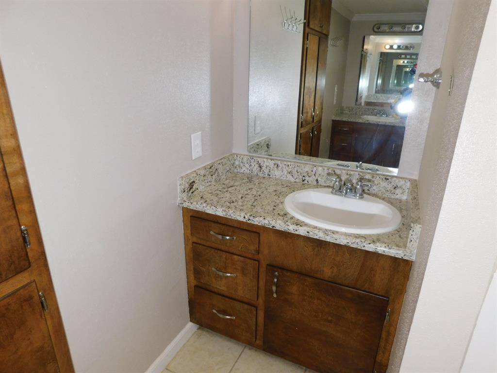 214 Springhill Airport Road Springhill, LA 71075 - Photo 19 of 32 a bathroom with a sink and a mirror