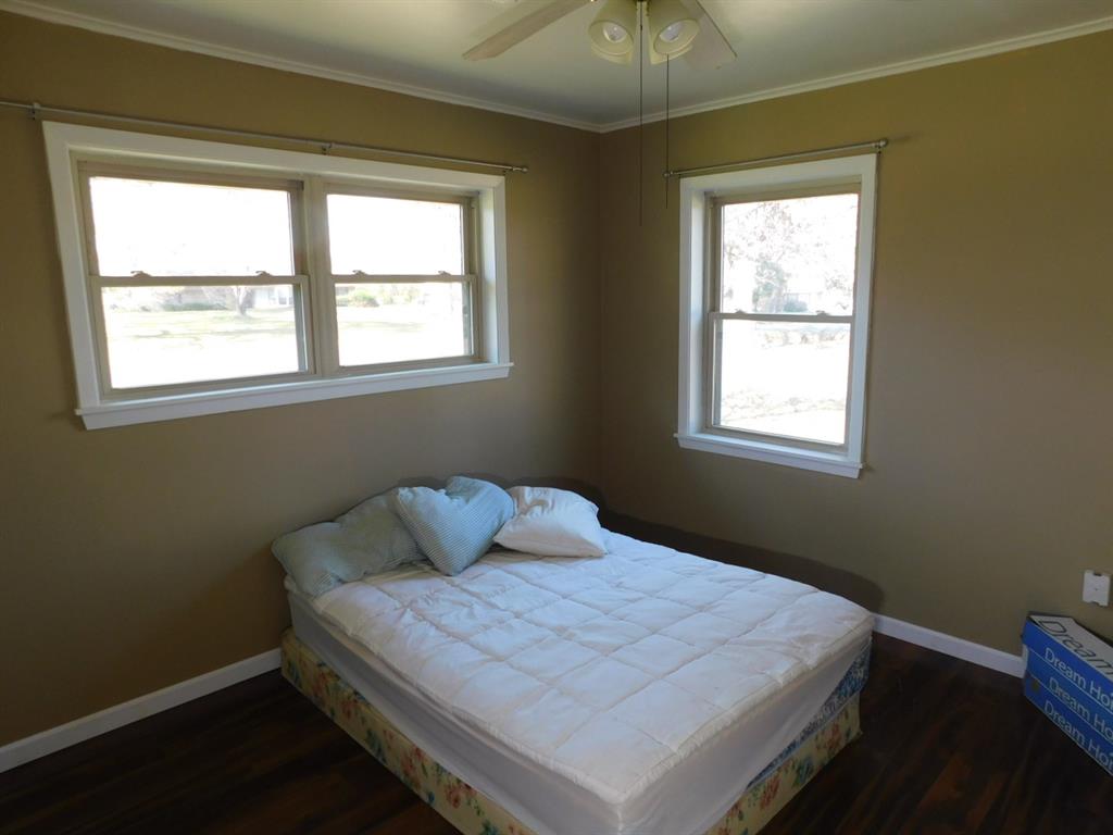 214 Springhill Airport Road Springhill, LA 71075 - Photo 29 of 32 a bedroom with a bed and a window
