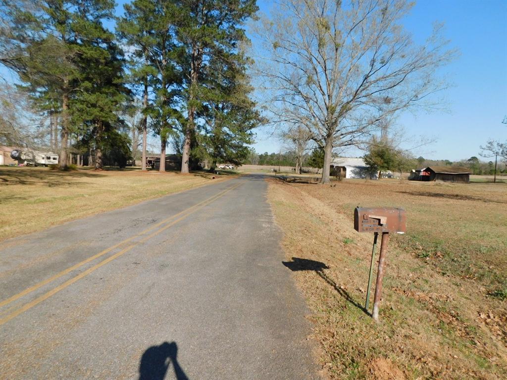 214 Springhill Airport Road Springhill, LA 71075 - Photo 3 of 32 a view of a lake with a tree