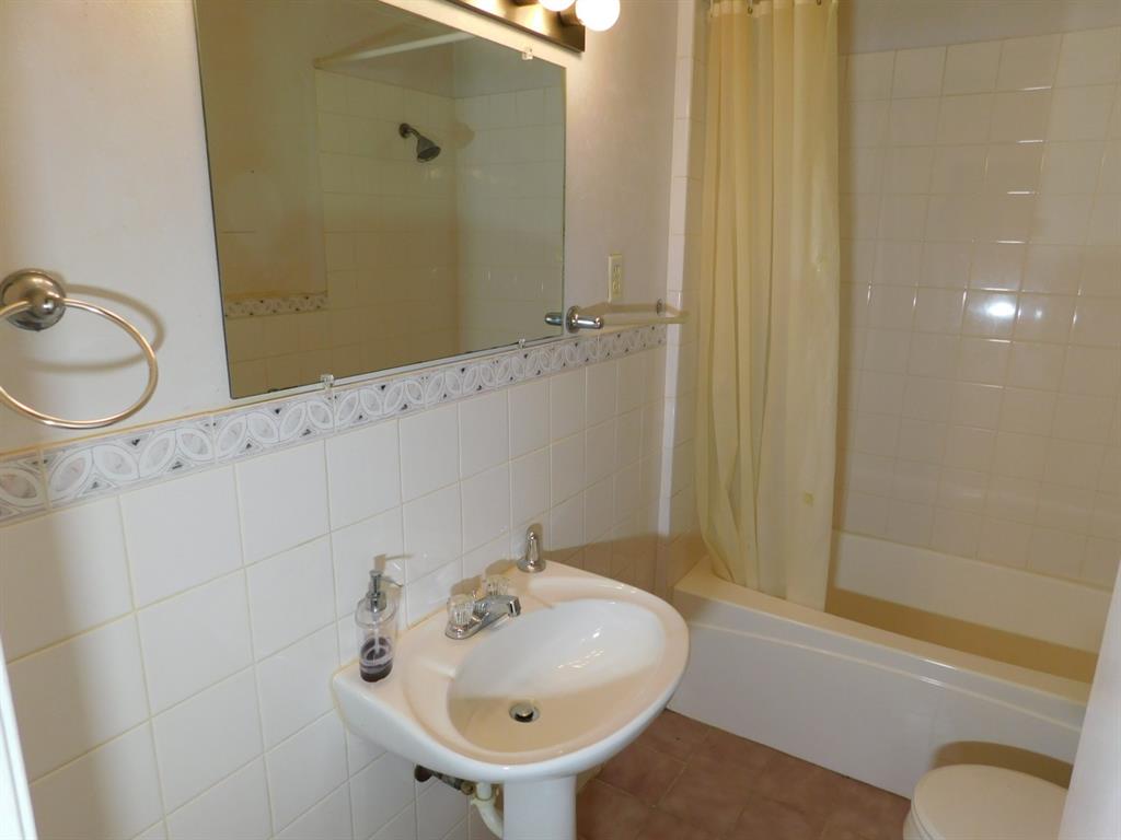 214 Springhill Airport Road Springhill, LA 71075 - Photo 31 of 32 a bathroom with a sink a toilet and shower