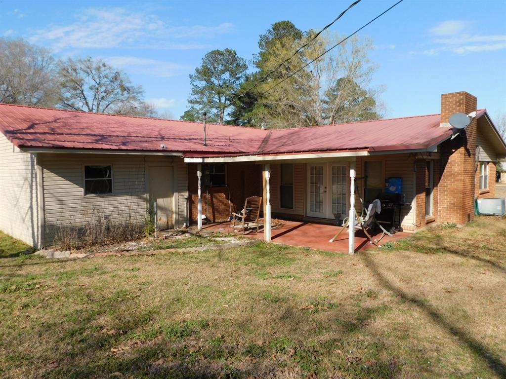214 Springhill Airport Road Springhill, LA 71075 - Photo 10 of 32 a view of a house with backyard porch and sitting area