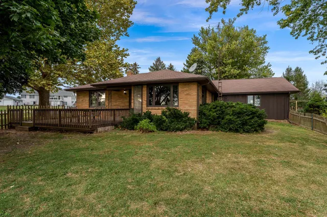 a backyard of a house with seating space