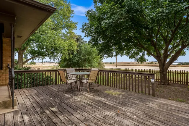 a hall with cabinets and wooden floor